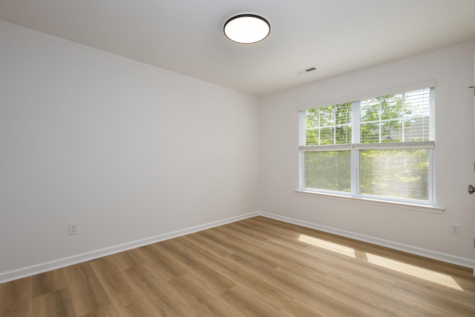 228 Skyros Loop Cary, NC 27519 - Photo 20 of 29 an empty room with a window