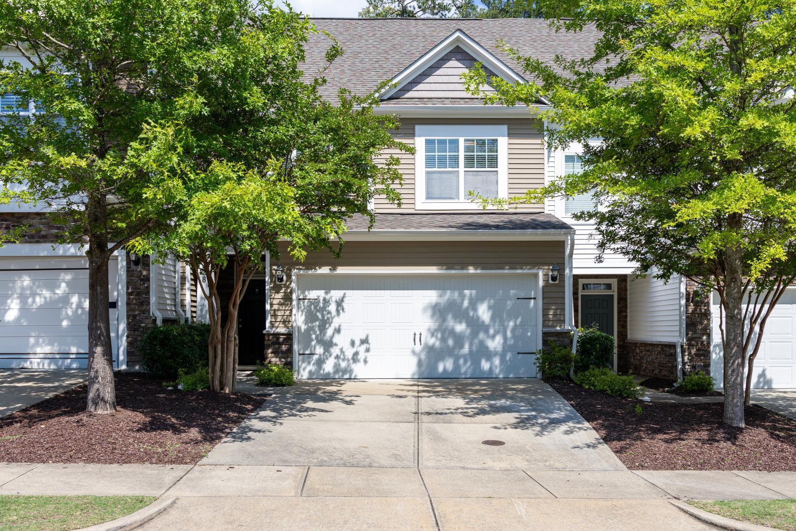 228 Skyros Loop Cary, NC 27519 - Photo 24 of 29 a front view of a house with garden