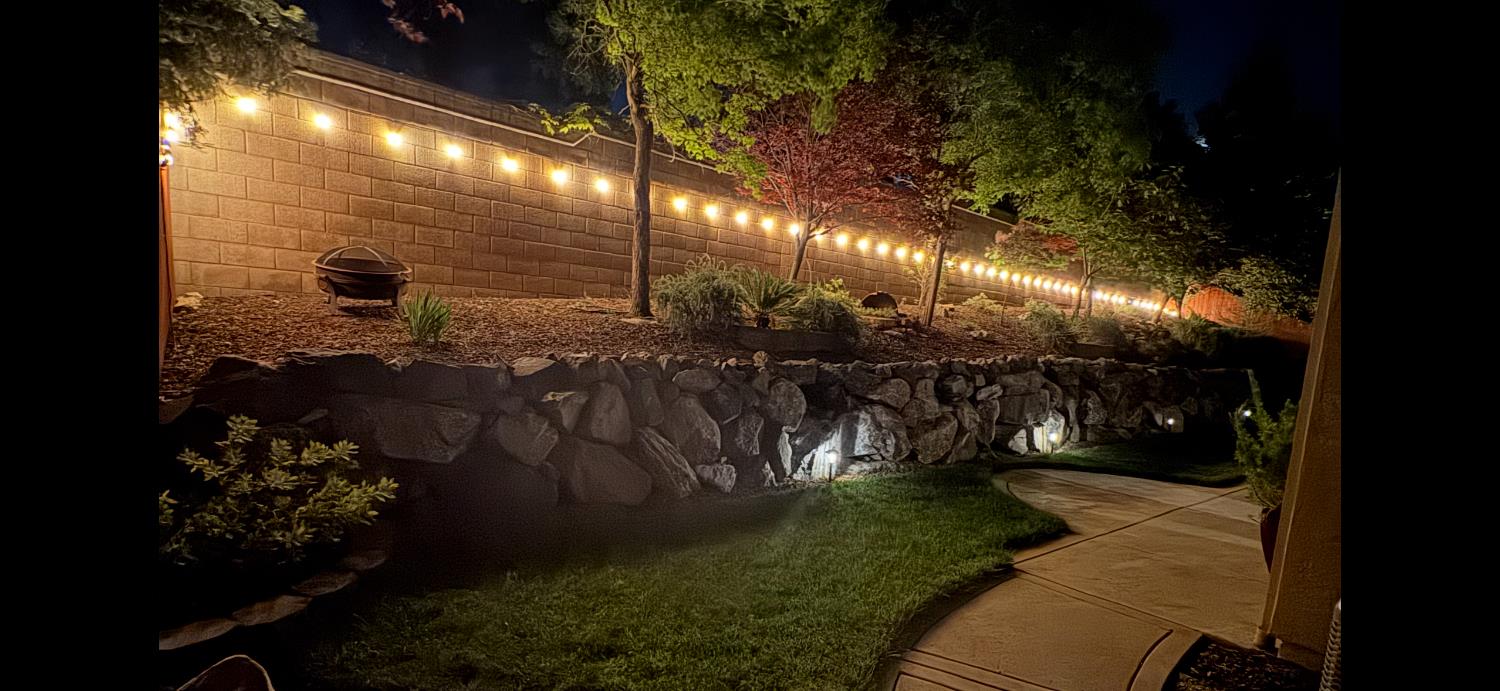 5950 Tanus Circle Rocklin, CA 95677 - Photo 59 of 70 Photo from 2025 showing evening landscape lighting.