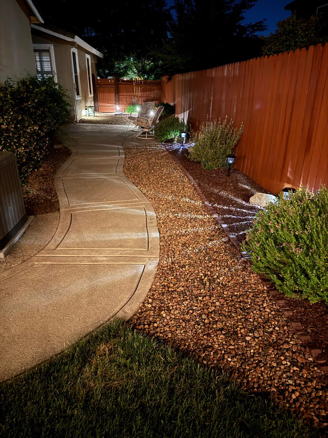 5950 Tanus Circle Rocklin, CA 95677 - Photo 62 of 70 Photo from 2025 showing evening landscape lighting.