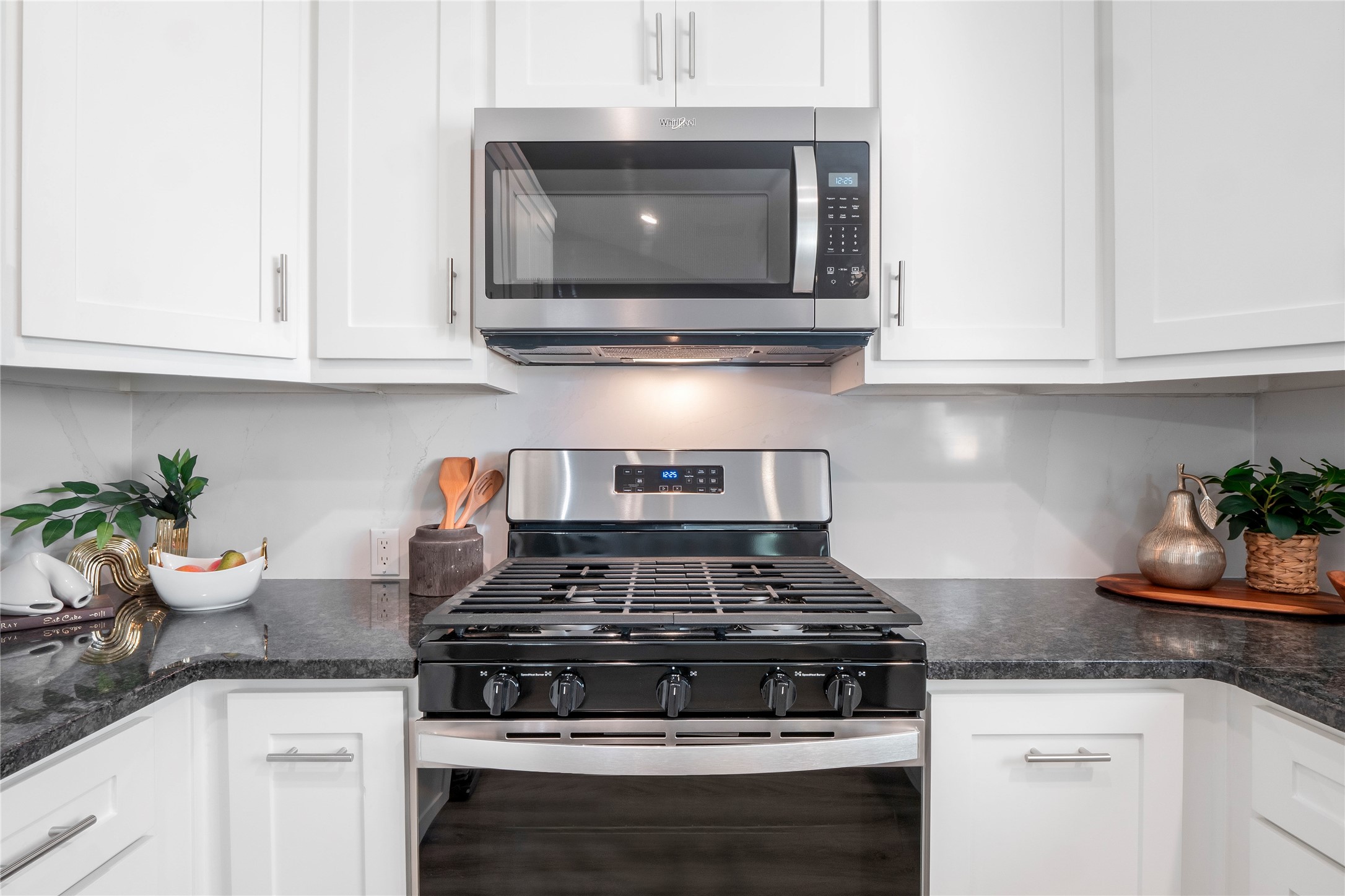 8007 Colony Loop Drive Austin, TX 78724 - Photo 34 of 40 Stainless gas range, built-in microwave, and granite countertops.