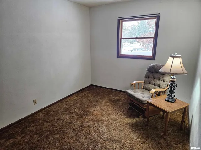 a workspace with furniture and window