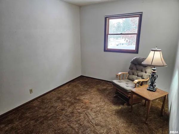 a workspace with furniture and window