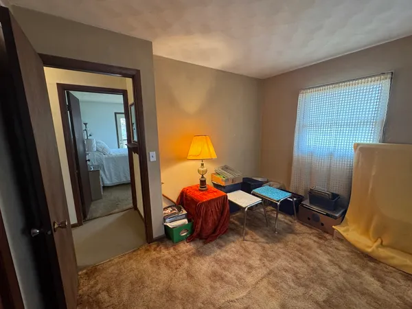 a room with furniture and gym equipment