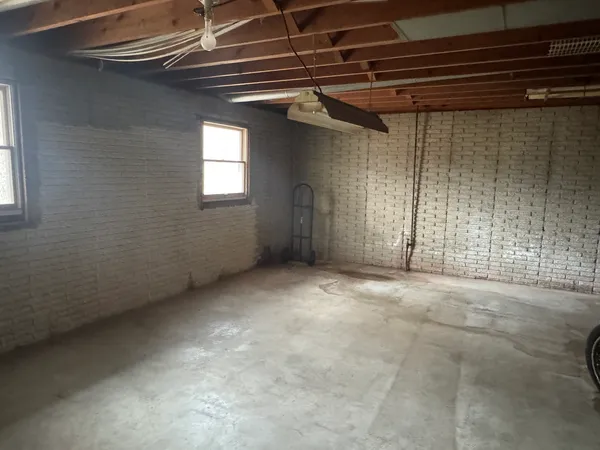 a view of livingroom with furniture and a large window