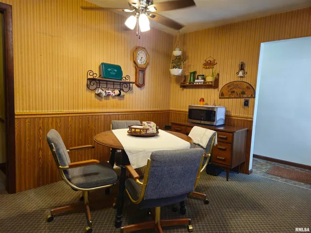 a workspace with furniture and chandelier