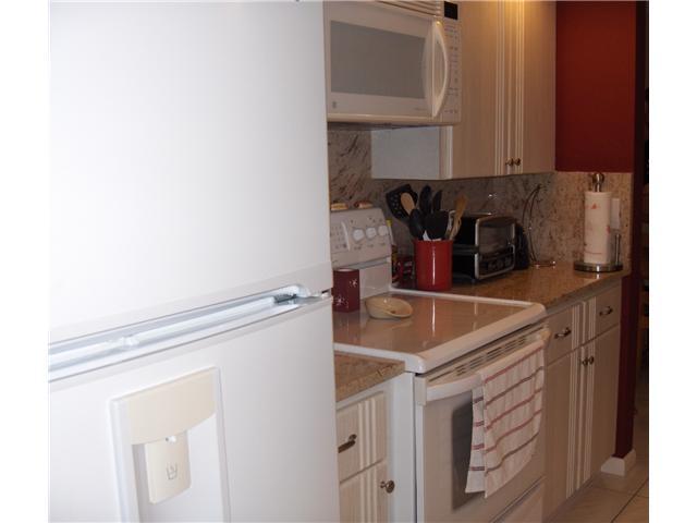 367 River Edge Road Jupiter, FL 33477 - Photo 3 of 17 a kitchen with a sink and cabinets