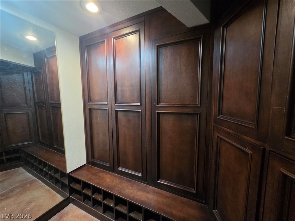 3381 Westwind Road Las Vegas, NV 89146 - Photo 37 of 52 This custom-built wardrobe with integrated shoe storage offers a polished organization solution.