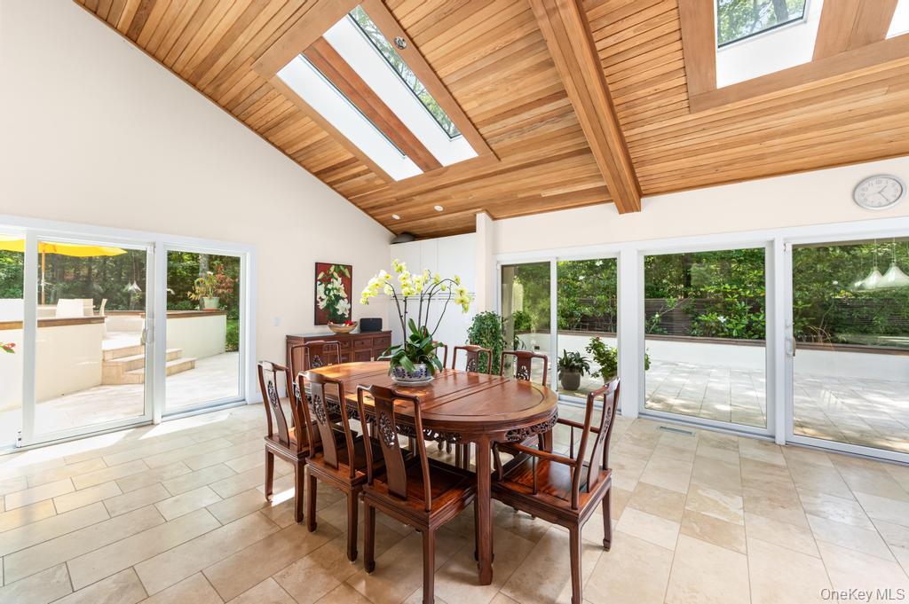2222 Noyack Road Sag Harbor, NY 11963 - Photo 14 of 47 a view of a dining room with furniture window and outside view