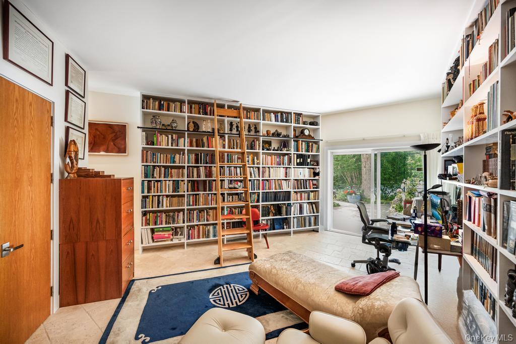 2222 Noyack Road Sag Harbor, NY 11963 - Photo 20 of 47 a living room with furniture and a window