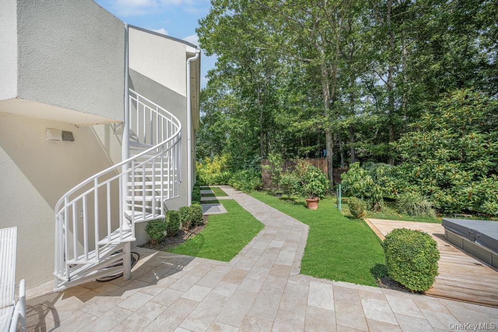 2222 Noyack Road Sag Harbor, NY 11963 - Photo 35 of 47 a view of a garden with large trees