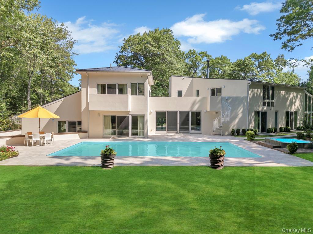 2222 Noyack Road Sag Harbor, NY 11963 - Photo 44 of 47 a front view of house with yard and green space