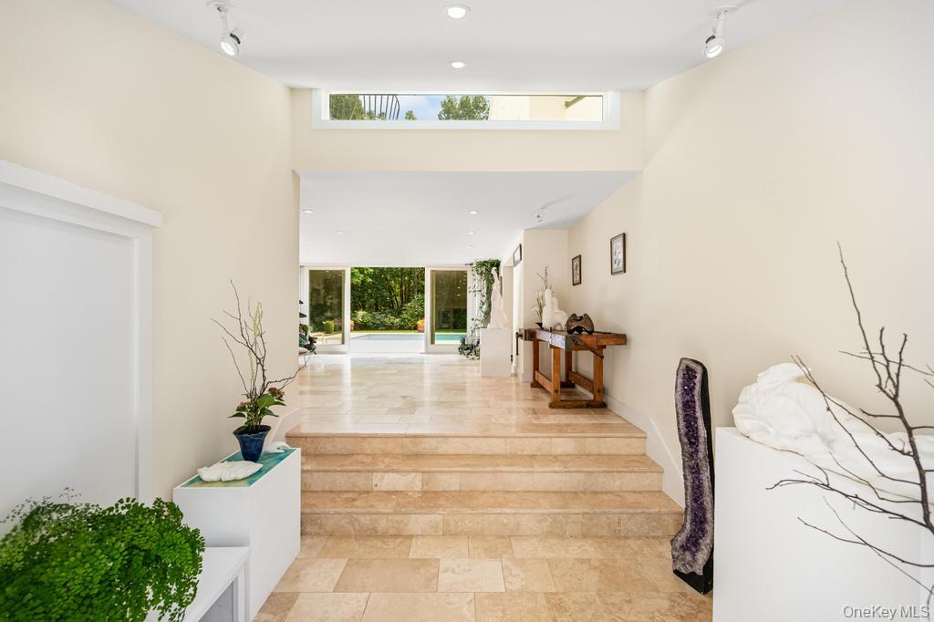 2222 Noyack Road Sag Harbor, NY 11963 - Photo 8 of 47 a lobby with furniture and a potted plant