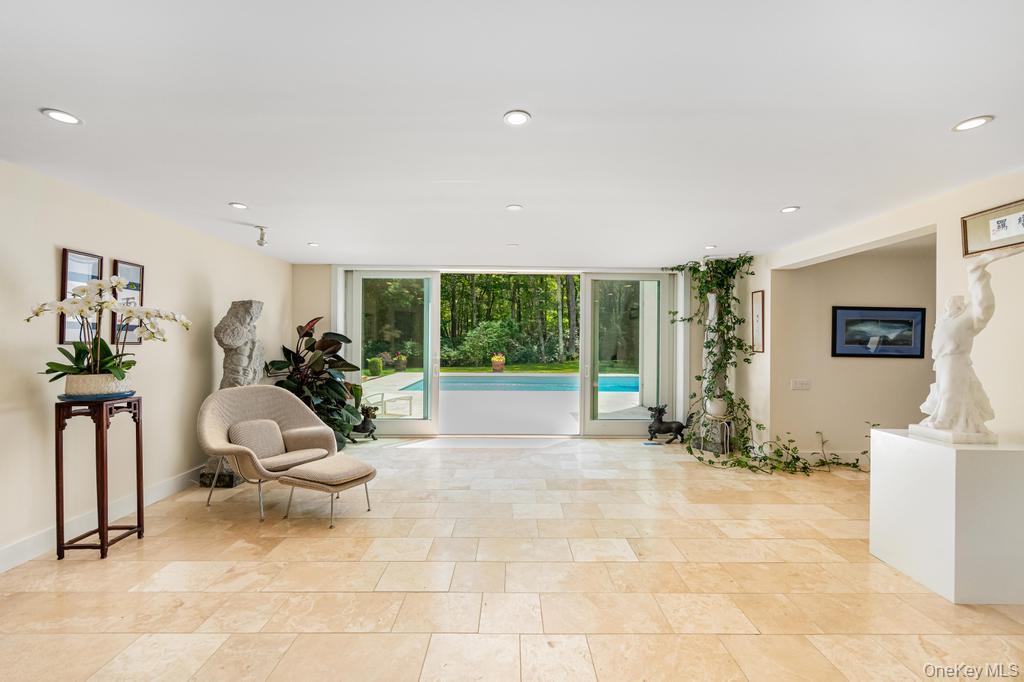 2222 Noyack Road Sag Harbor, NY 11963 - Photo 9 of 47 a view of a livingroom with workspace and a window