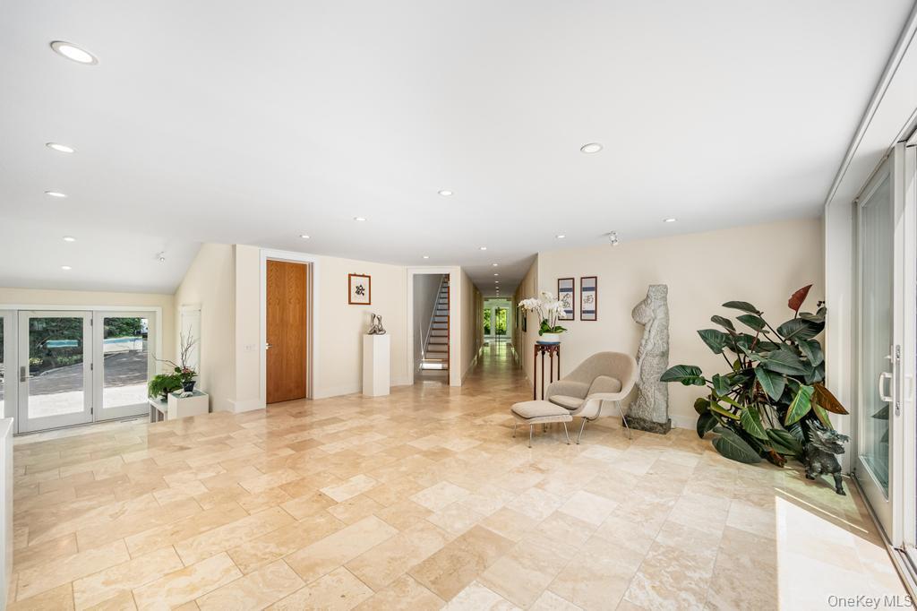 2222 Noyack Road Sag Harbor, NY 11963 - Photo 10 of 47 a view of a livingroom with furniture and a potted plant