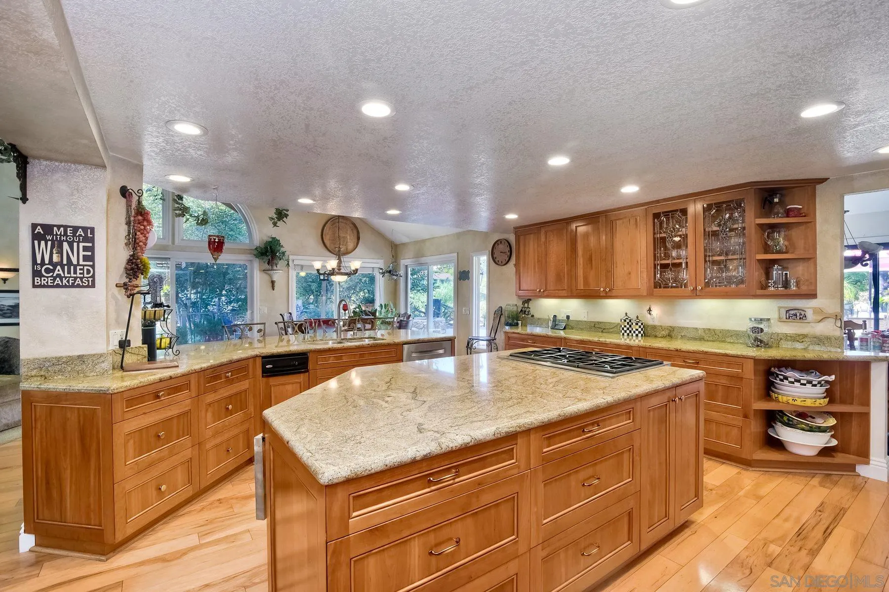 14248 Ipava Drive Poway, CA 92064 - Photo 11 of 34 a kitchen with a stove a counter top space and cabinets