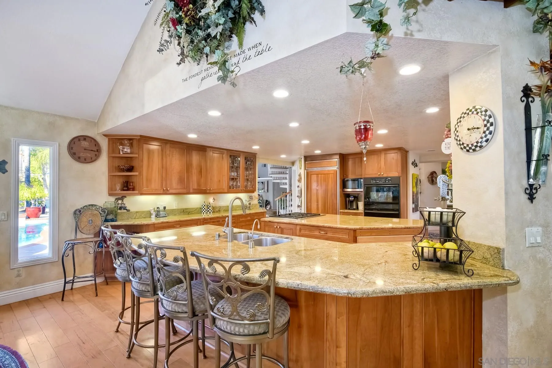 14248 Ipava Drive Poway, CA 92064 - Photo 13 of 34 a kitchen with a table and chairs in it