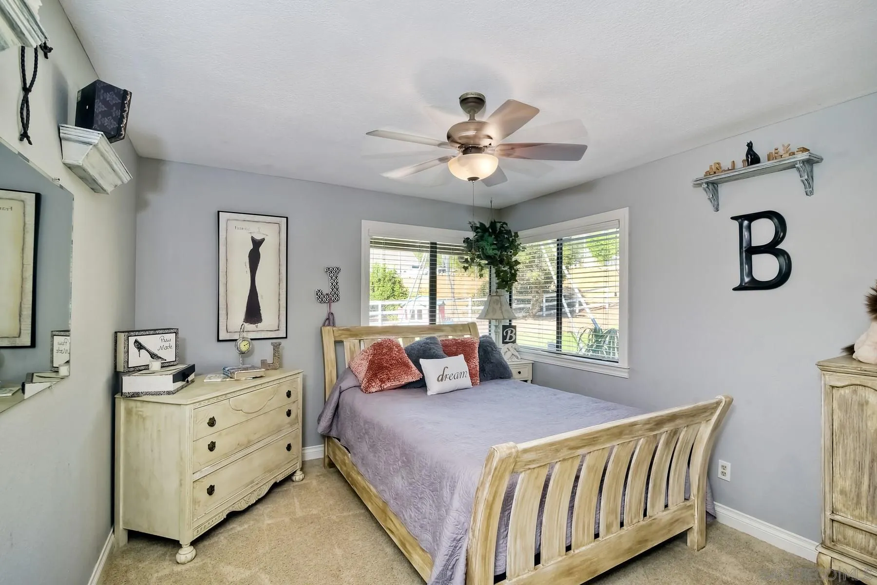 14248 Ipava Drive Poway, CA 92064 - Photo 15 of 34 a spacious bedroom with a bed and window