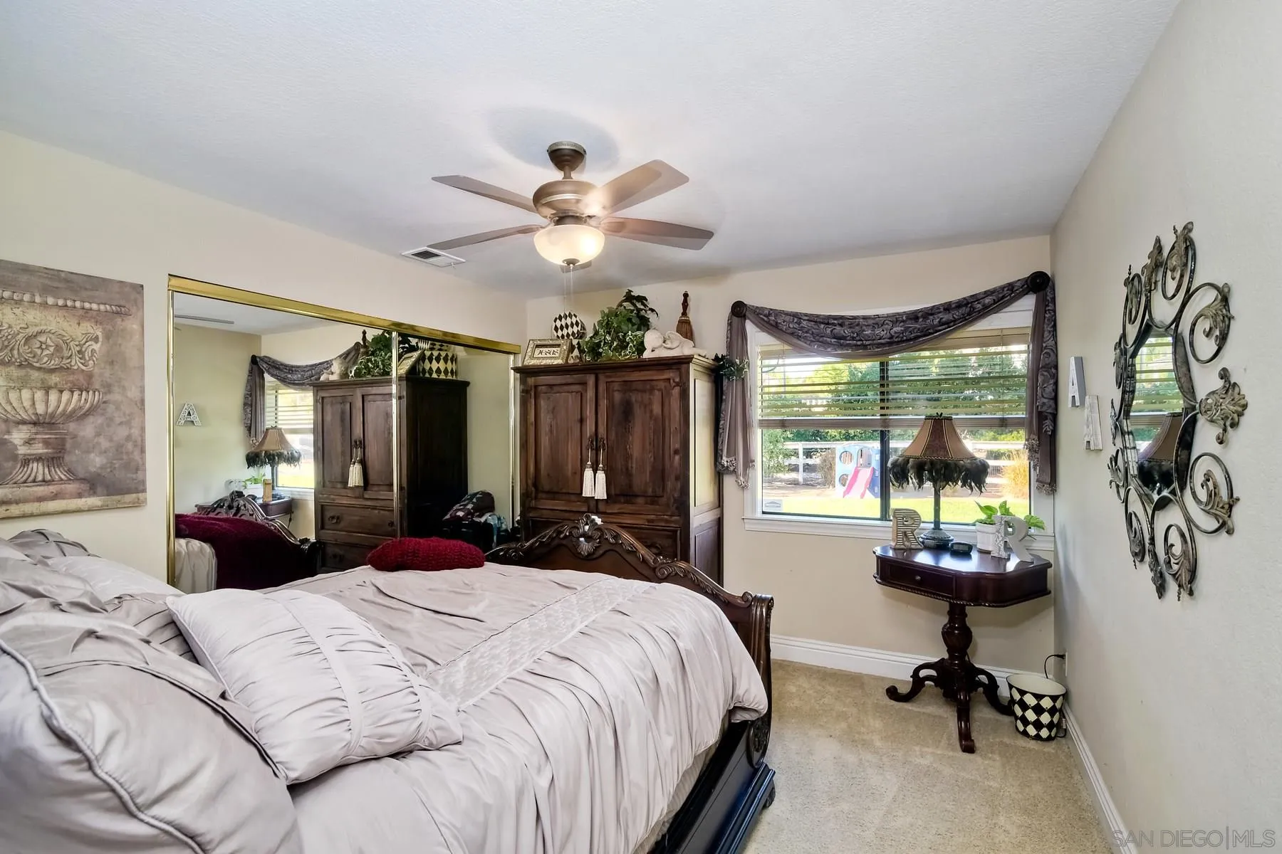 14248 Ipava Drive Poway, CA 92064 - Photo 16 of 34 a bedroom with a bed a large window with table and chairs