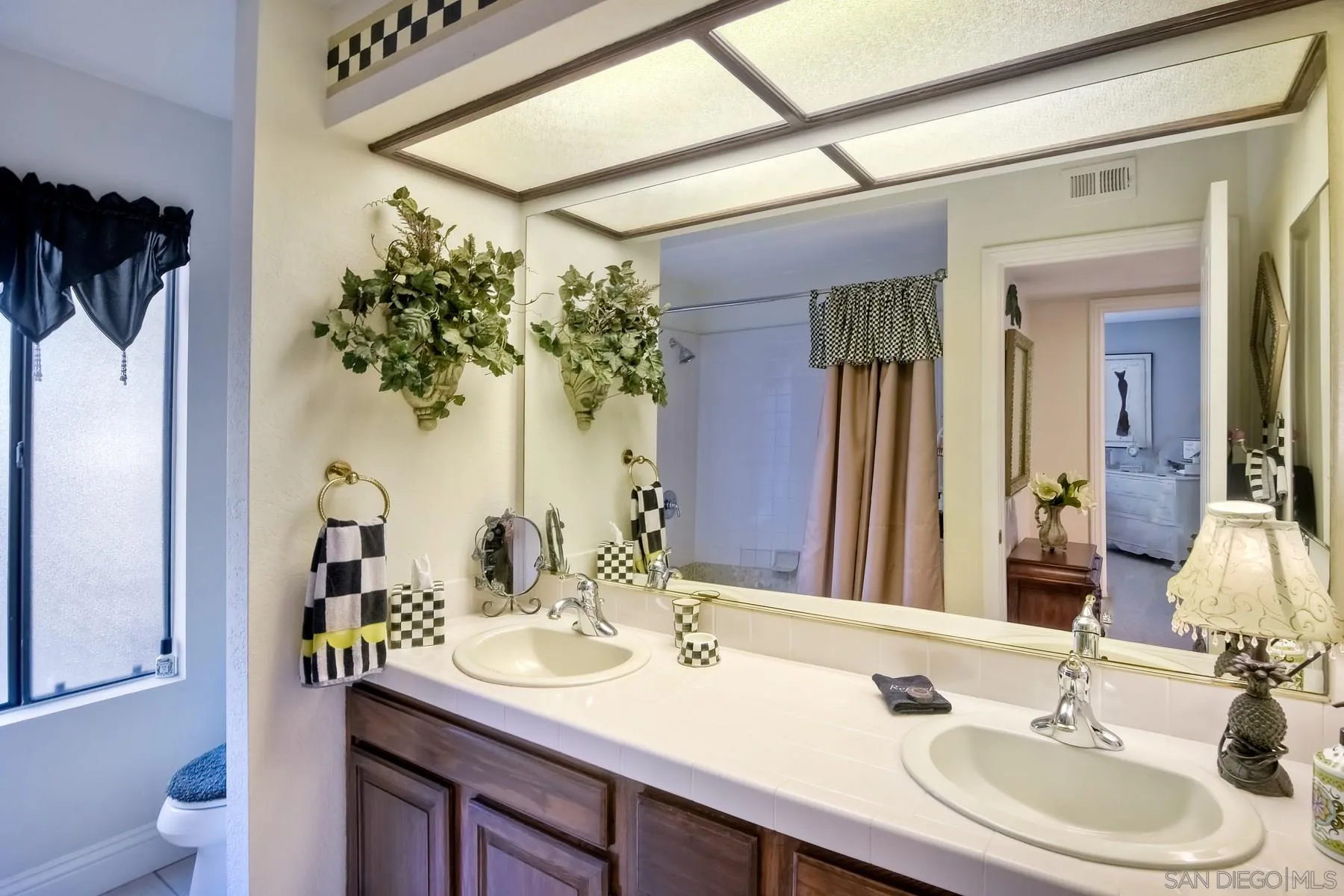 14248 Ipava Drive Poway, CA 92064 - Photo 17 of 34 a bathroom with a sink and a mirror