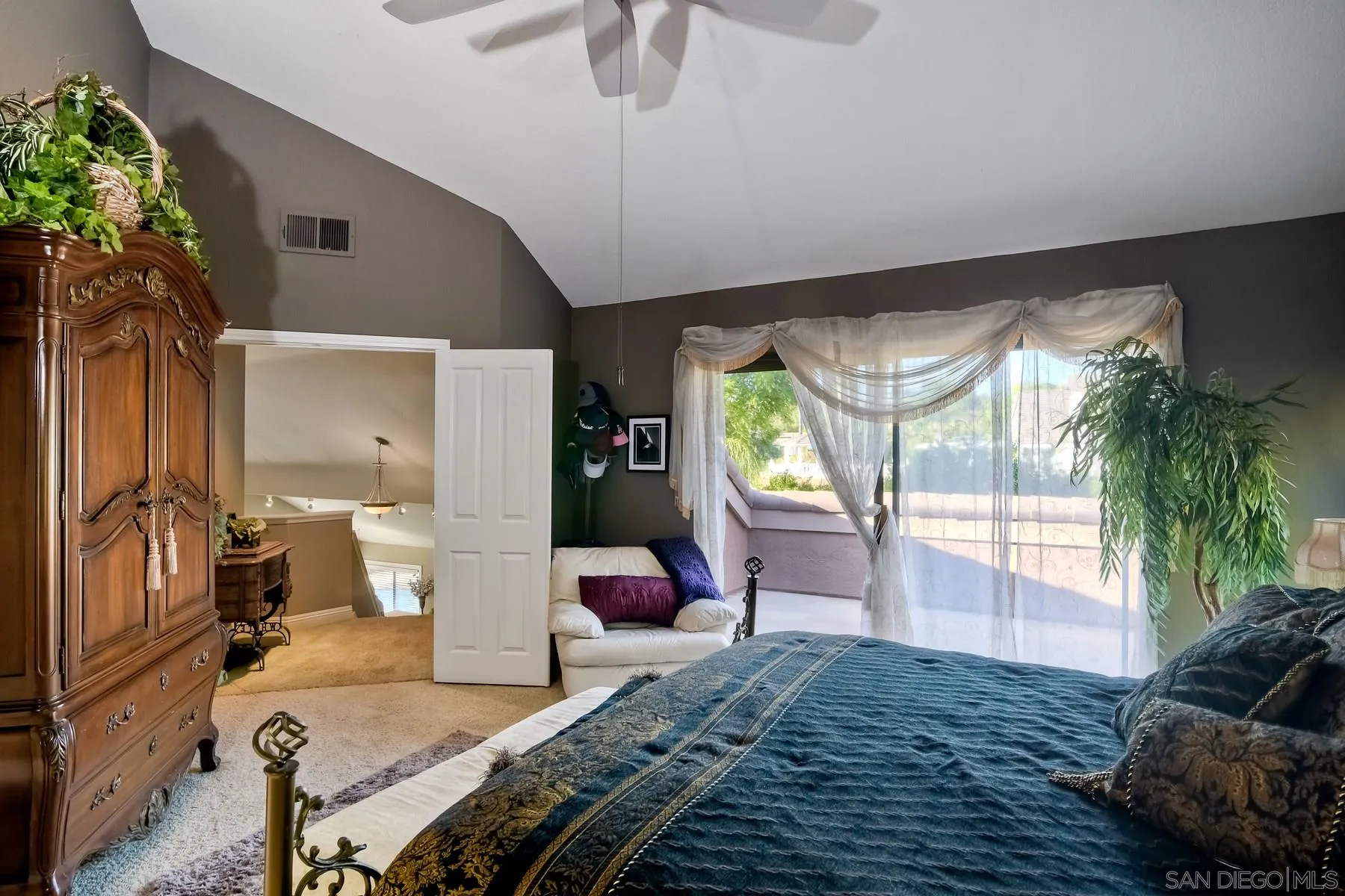 14248 Ipava Drive Poway, CA 92064 - Photo 20 of 34 a bedroom with furniture and a large window