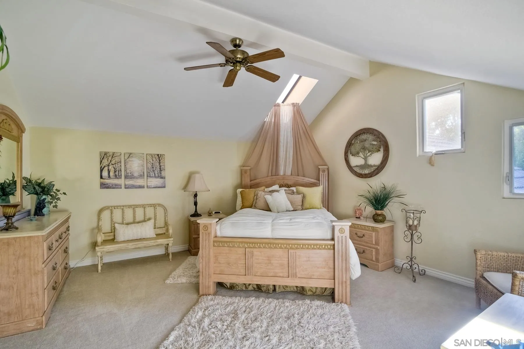 14248 Ipava Drive Poway, CA 92064 - Photo 22 of 34 a bedroom with a bed and a chandelier