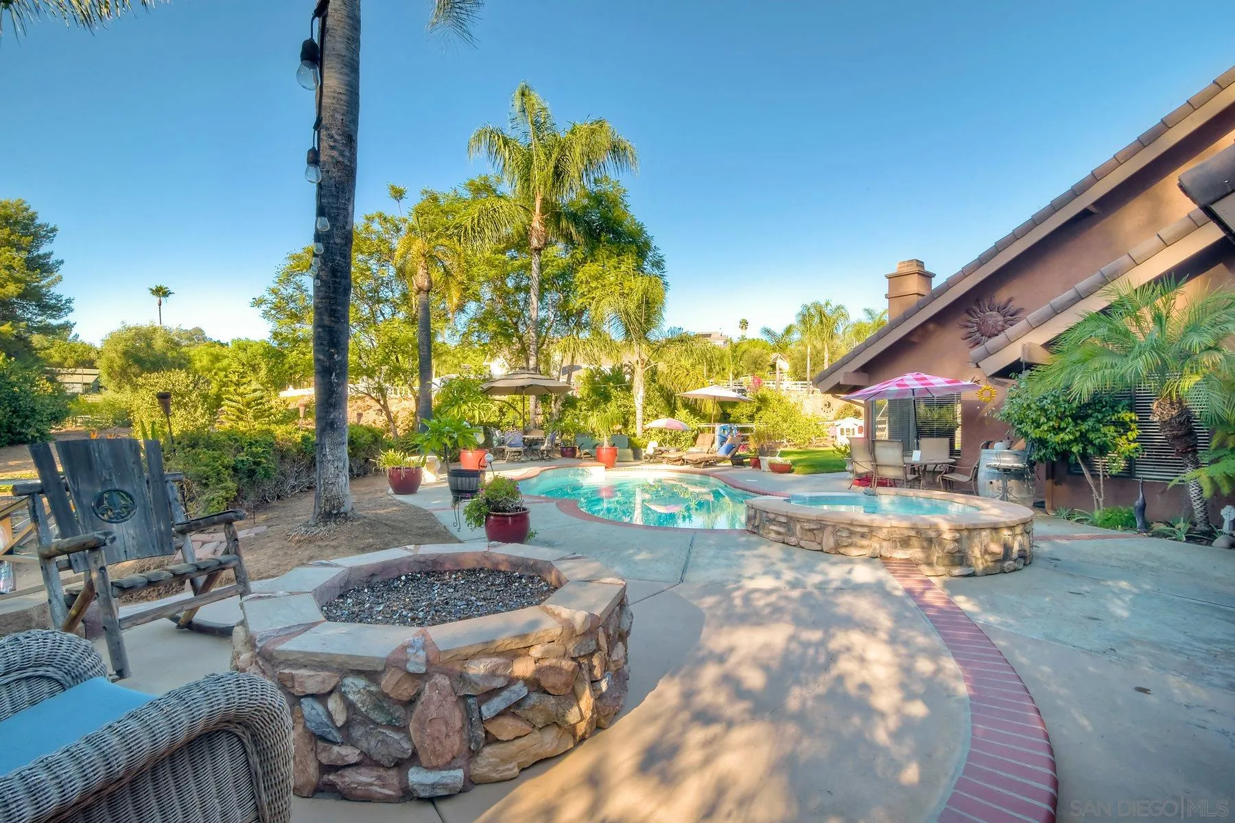 14248 Ipava Drive Poway, CA 92064 - Photo 24 of 34 a view of a backyard with plants and patio