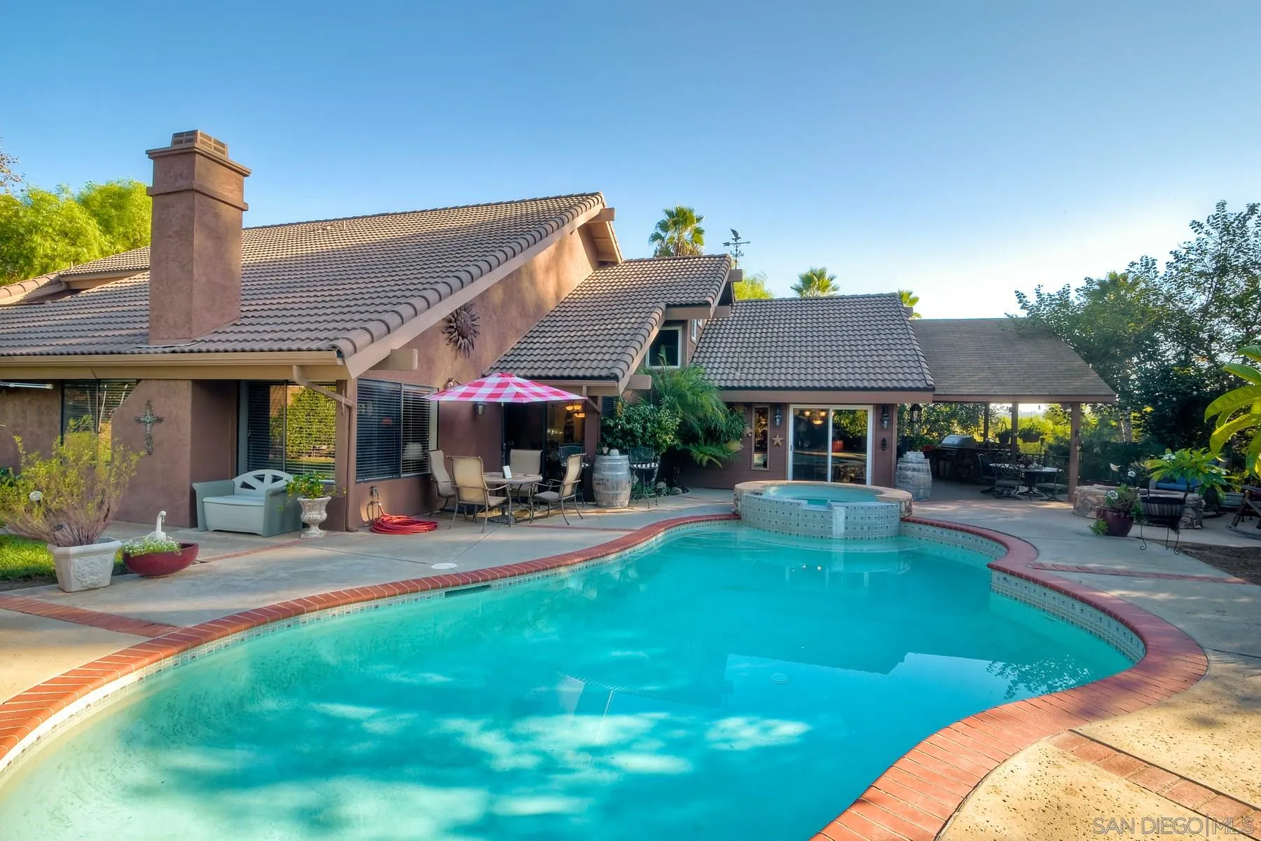 14248 Ipava Drive Poway, CA 92064 - Photo 25 of 34 a view of a house with swimming pool and sitting area