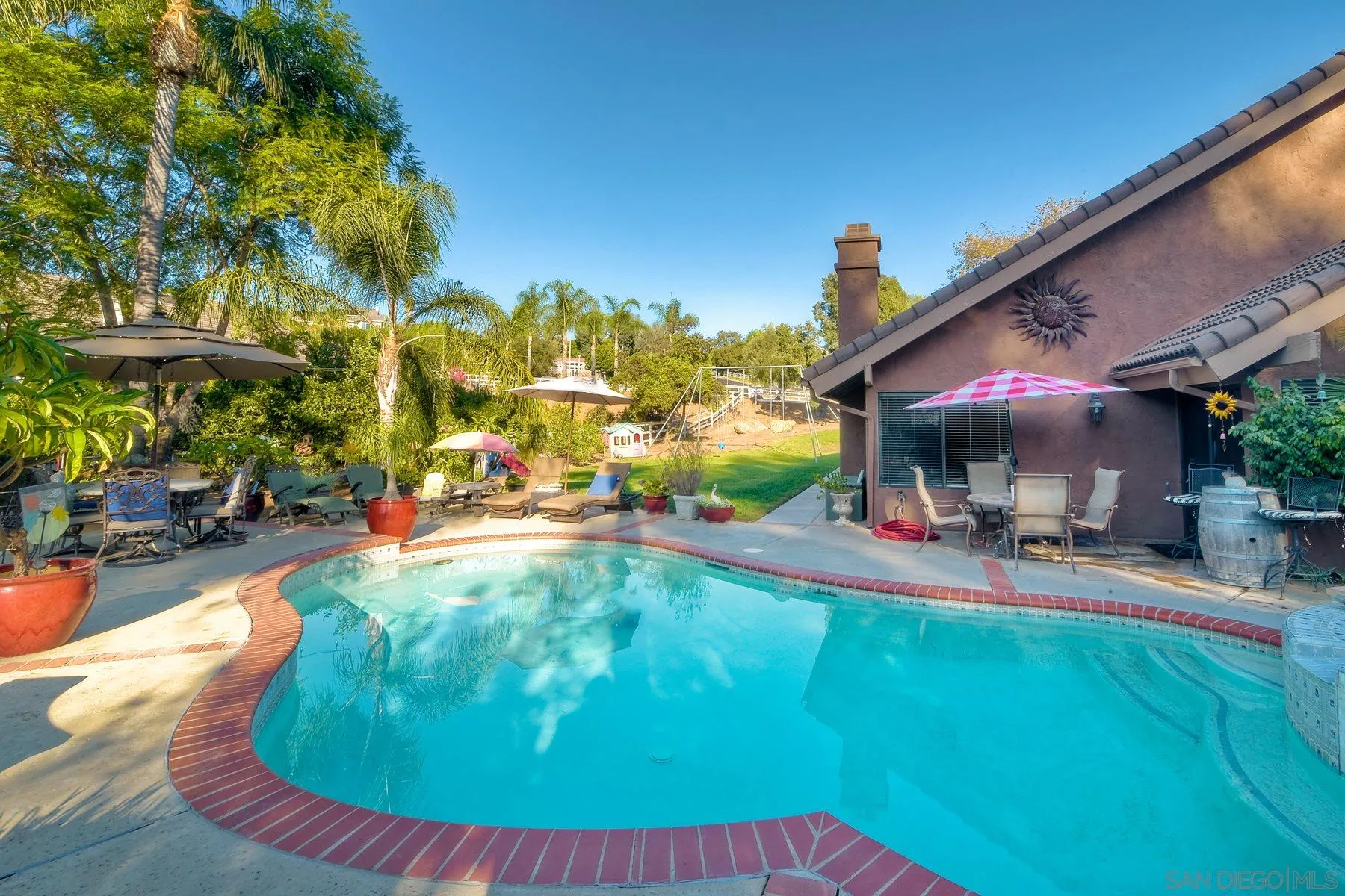 14248 Ipava Drive Poway, CA 92064 - Photo 26 of 34 a view of a swimming pool with sitting area