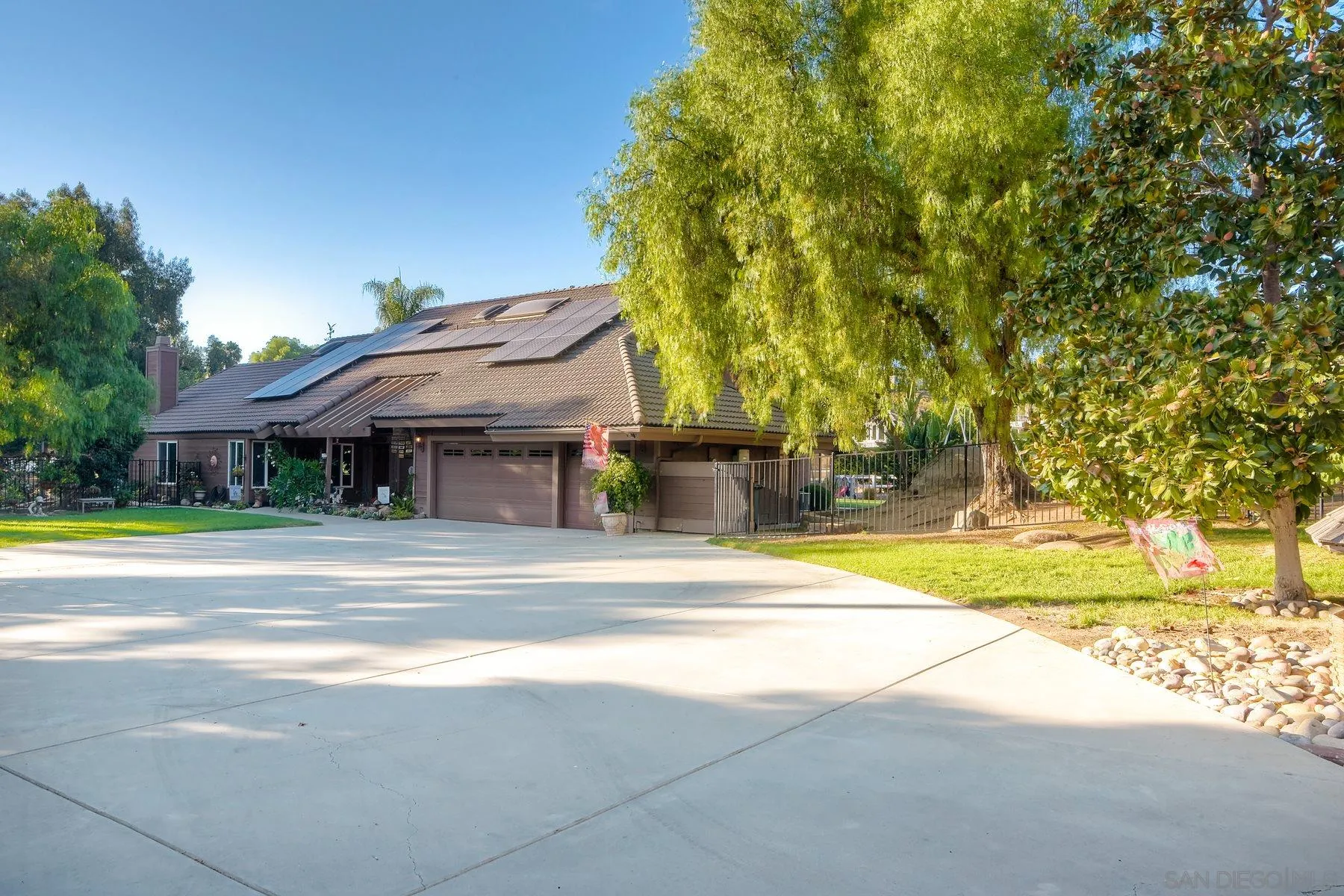 14248 Ipava Drive Poway, CA 92064 - Photo 3 of 34 a view of a house with a yard and tree s