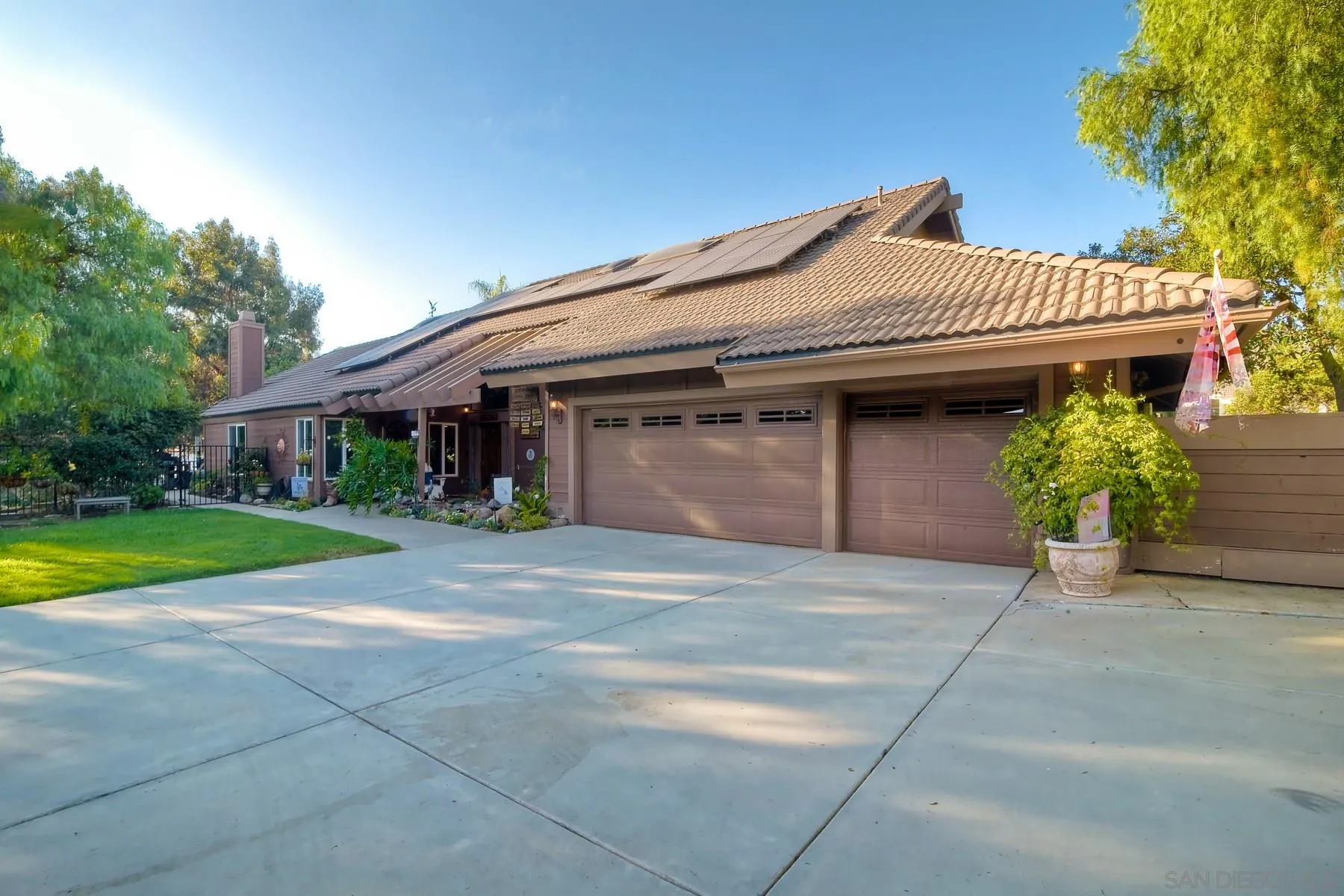 14248 Ipava Drive Poway, CA 92064 - Photo 4 of 34 a front view of a house with a yard and garage