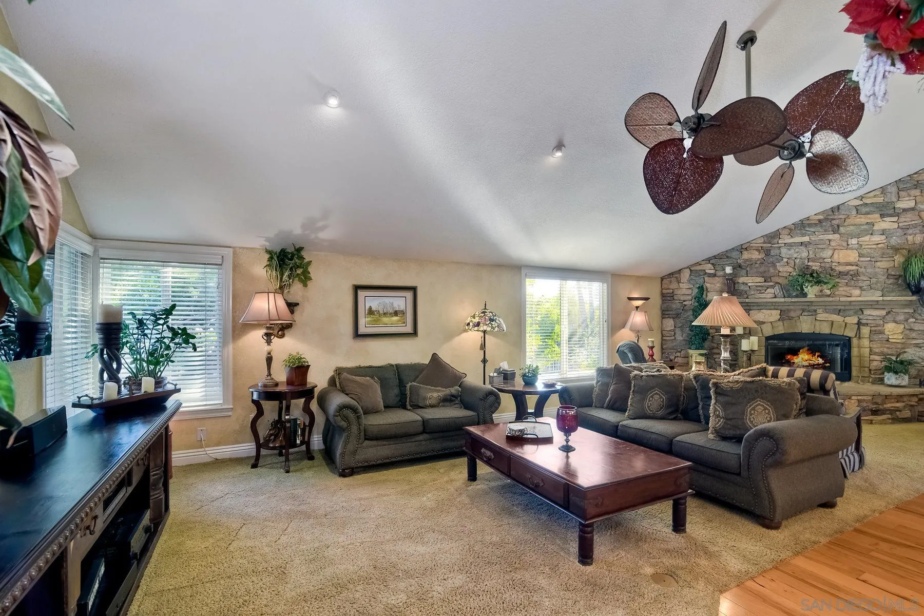 14248 Ipava Drive Poway, CA 92064 - Photo 6 of 34 a living room with furniture kitchen view and a chandelier