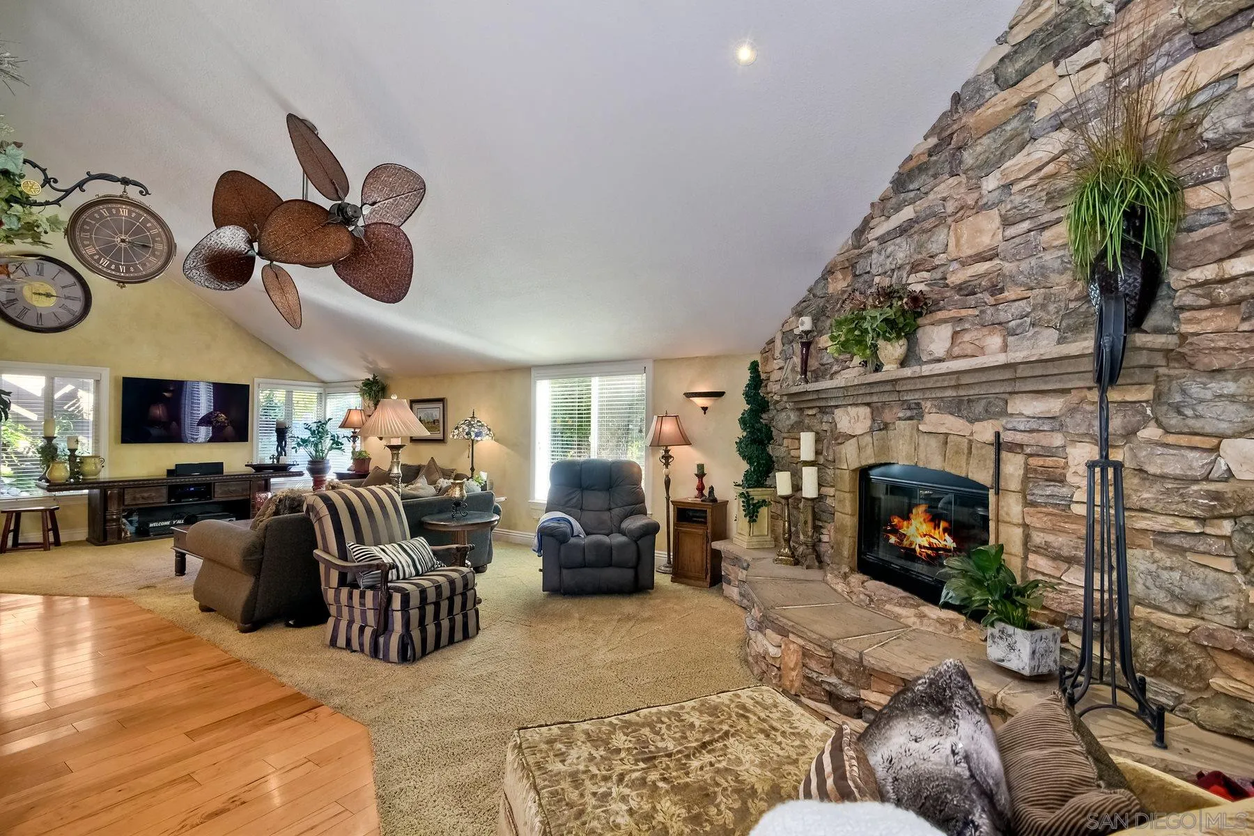 14248 Ipava Drive Poway, CA 92064 - Photo 9 of 34 a living room with furniture a fireplace and white walls
