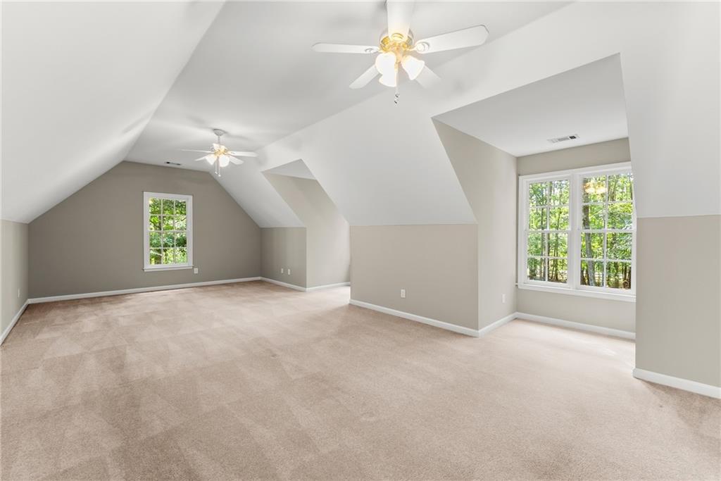 1040 Auburn Road Dacula, GA 30019 - Photo 33 of 42 an empty room with windows and fan