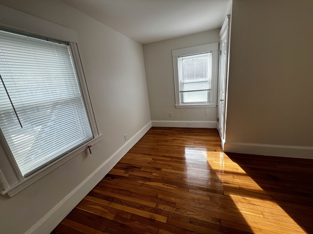 8 Winborough Street Boston, MA 02136 - Photo 7 of 12 a view of a room with wooden floor and chair