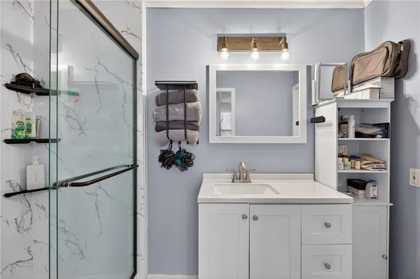 a bathroom with a sink and a mirror