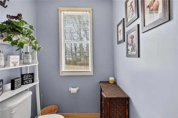 a view of hallway with furniture and a potted plant