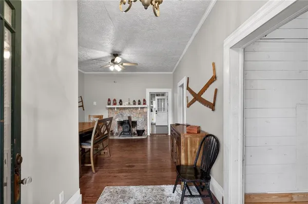 a view of a livingroom with chairs and furniture