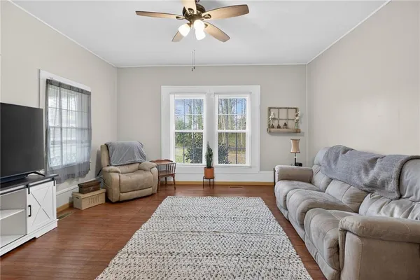 a living room with furniture and a flat screen tv