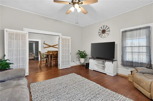 a living room with furniture and a flat screen tv