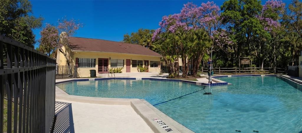 7327 Abonado Road, Unit 7327 Tampa, FL 33615 - Photo 7 of 9 a view of a house with swimming pool and sitting area