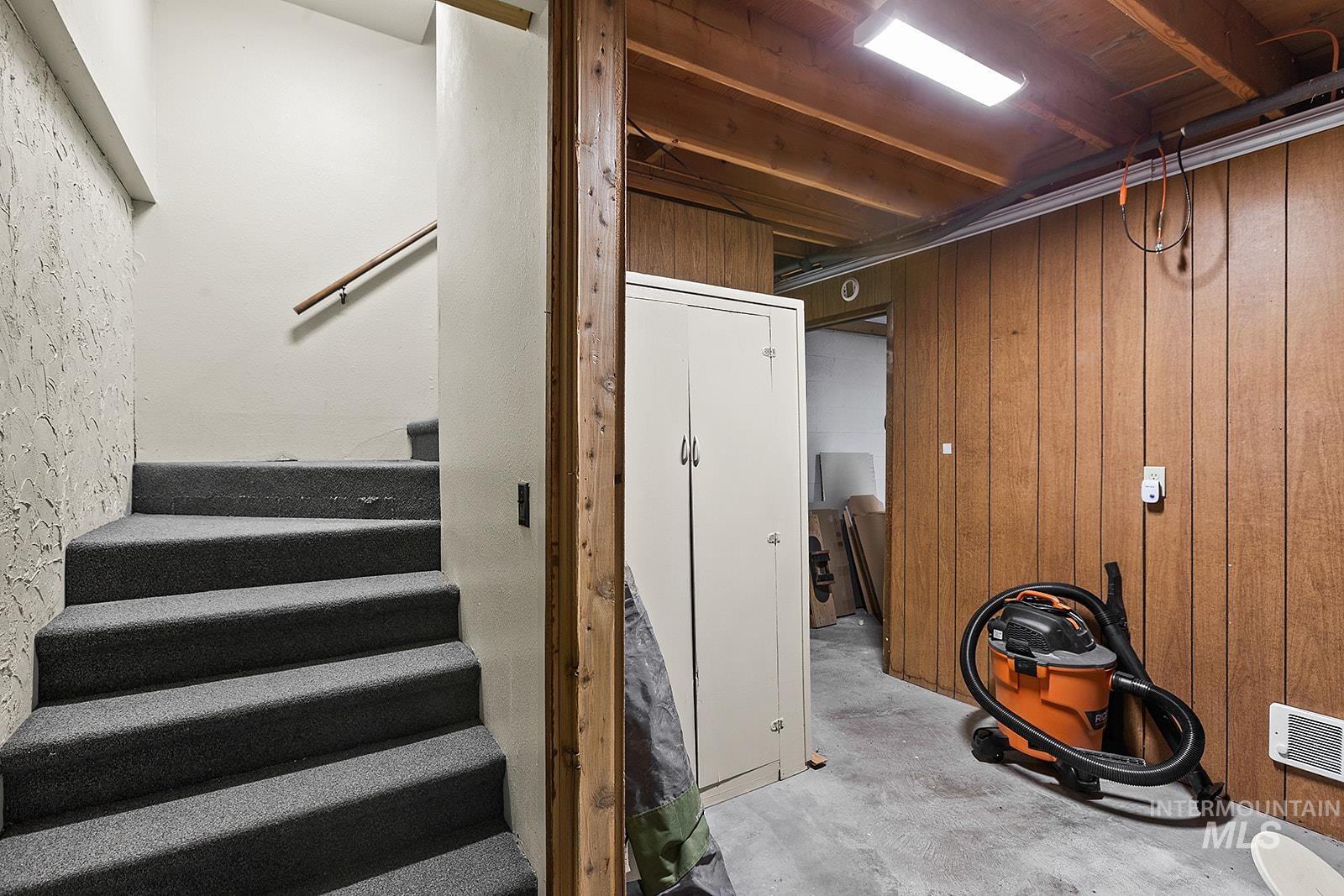 25314 Soldiers Meadow Road Winchester, ID 83555 - Photo 28 of 45 Basement with wooden walls and stairway