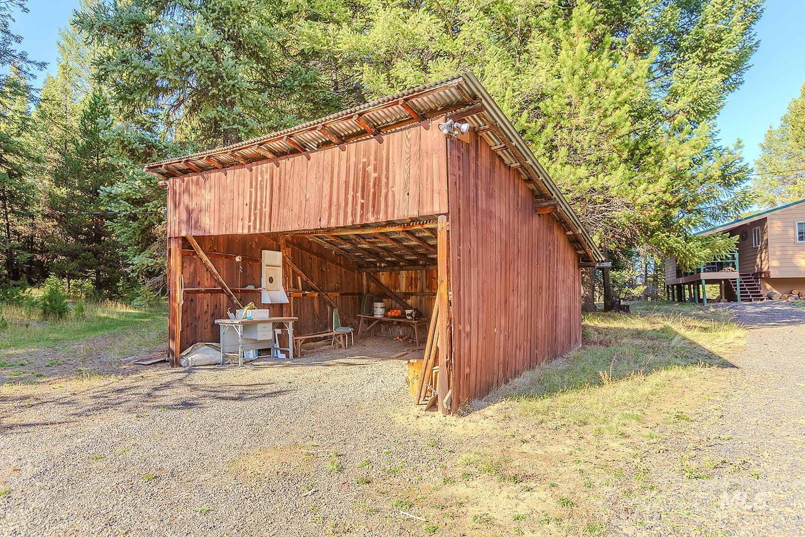 25314 Soldiers Meadow Road Winchester, ID 83555 - Photo 41 of 45 View of pole building with a forest view