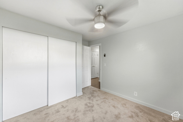 8746 Gladiator Way Sandy, UT 84094 - Photo 16 of 36 Wall-to-wall carpeting and a ceiling fan with integrated lighting