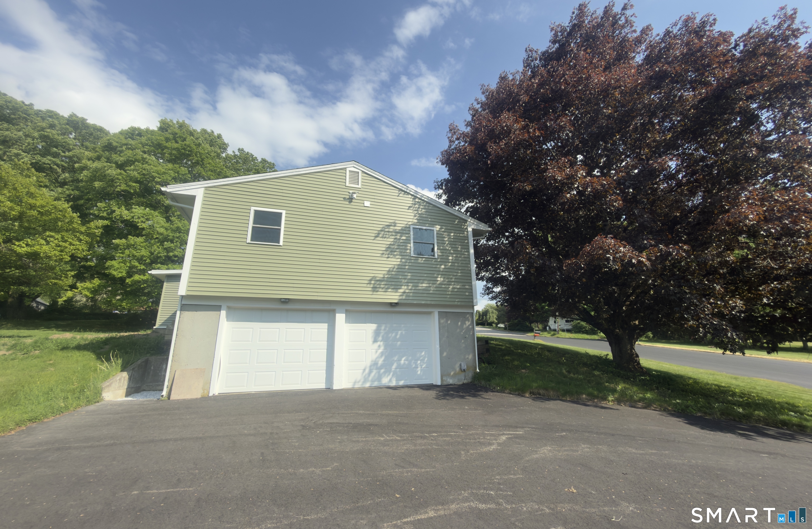 44 Polly Avenue Killingly, CT 06239 - Photo 2 of 22 a front view of a house with garden