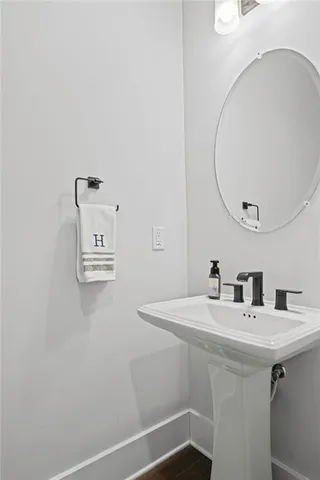 a view of a livingroom with a hardwood floor and a ceiling fan