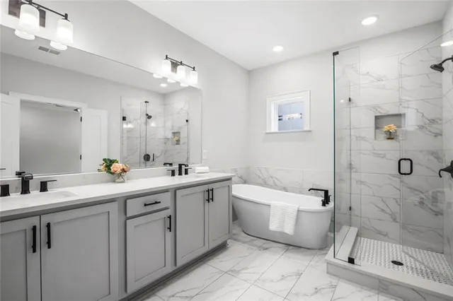 an empty room with a window and a ceiling fan