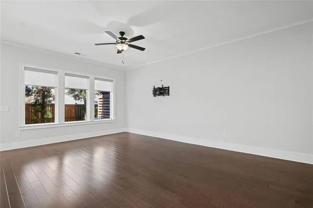 a living room with furniture kitchen view and a chandelier
