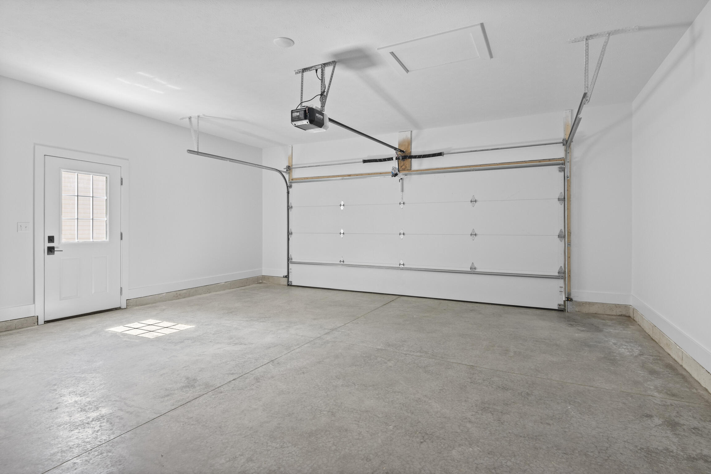 1941 Pine Ridge Drive Manistee, MI 49660 - Photo 24 of 46 Garage with service door