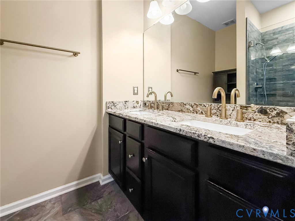 7809 Chasing Lane Richmond, VA 23237 - Photo 13 of 23 a bathroom with a granite countertop sink and a mirror